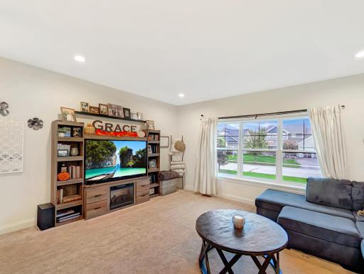 This inviting living room stays bright and cozy with its large window!
