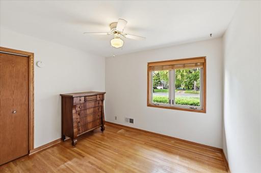 All bedrooms have large windows with blinds for privacy and ceiling fans