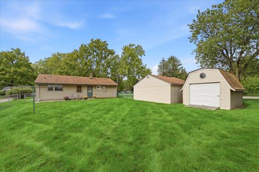 The large backyard has a storage shed, only accessible through the fenced-in area