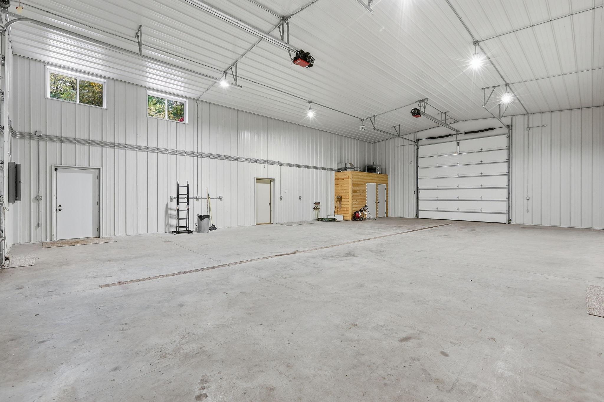 Spacious 34'x54' Finished and Heated Shop with 14' Garage Doors at Both Ends