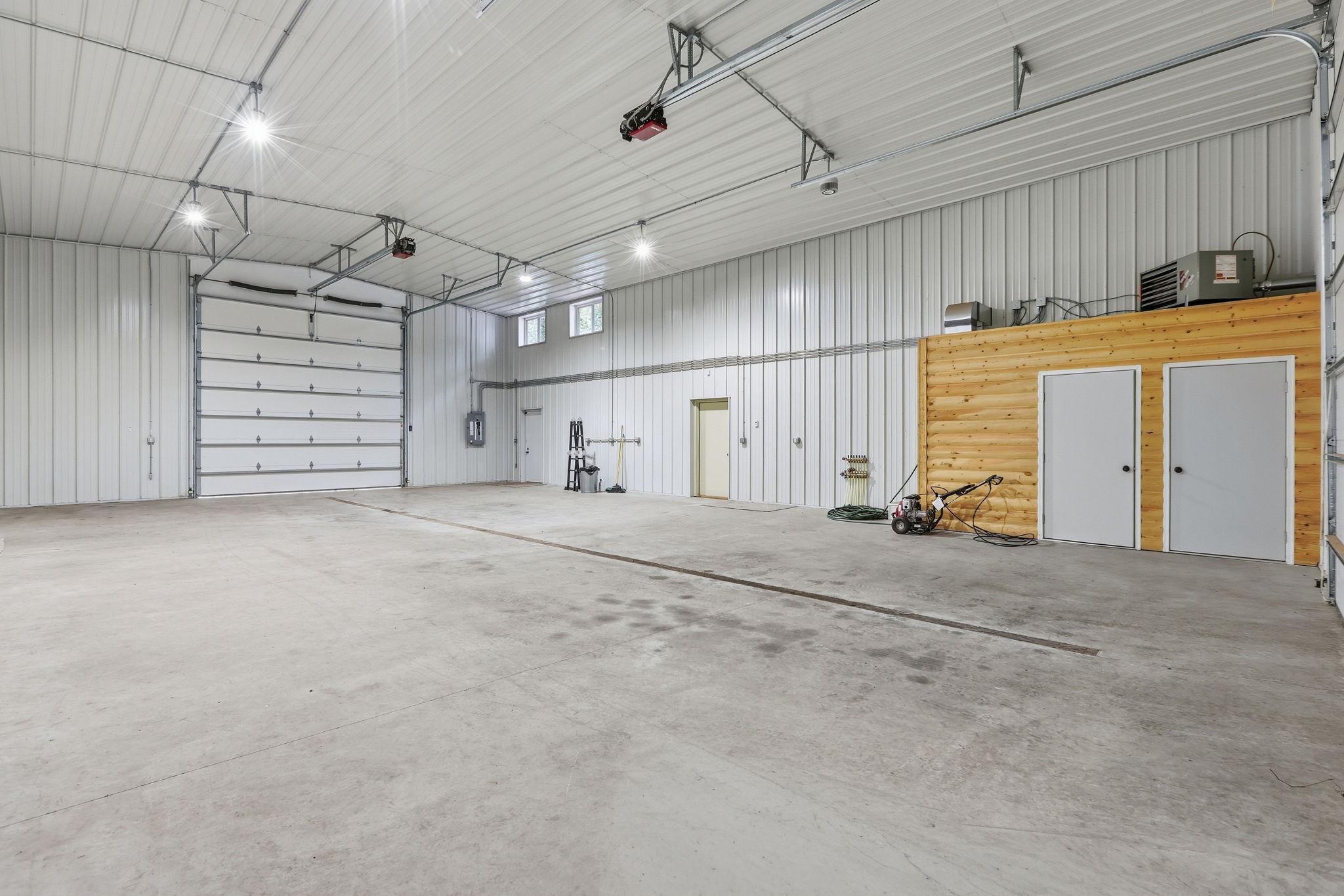 Spacious 34'x54' Finished and Heated Shop with 14' Garage Doors at Both Ends
