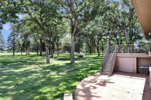 Great backyard space off the 12th hole of Oak Hill Golf Club, and storage under the deck.