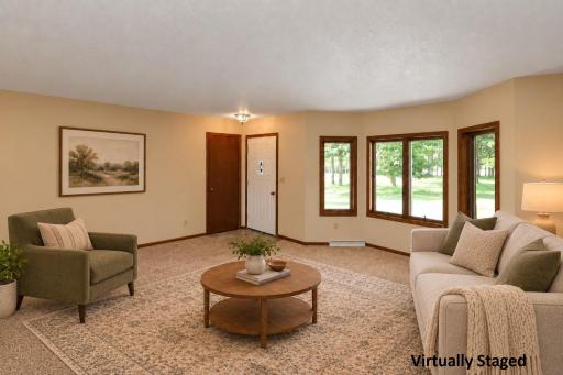 Living room with loads of natural light (staged).