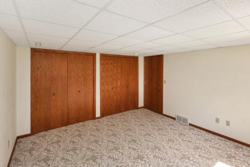 Lower level bedroom four with double closets.