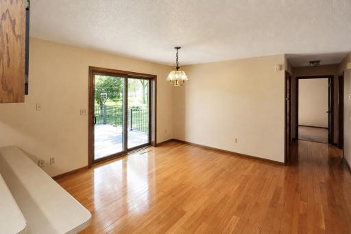 Spacious dining area with a patio door leading to the backyard deck (2).