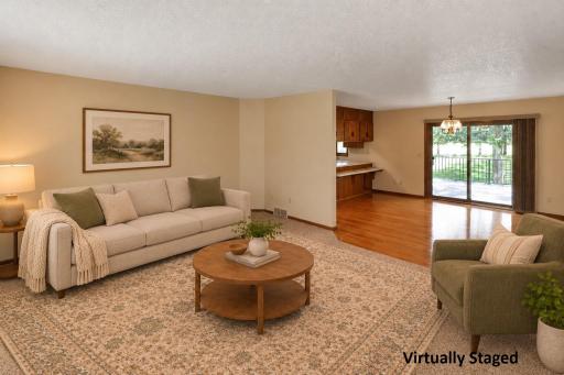 Spacious living room view, open to the dining area (staged)