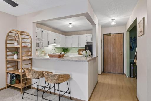 #120 has an open kitchen and ample hall closet for storage.