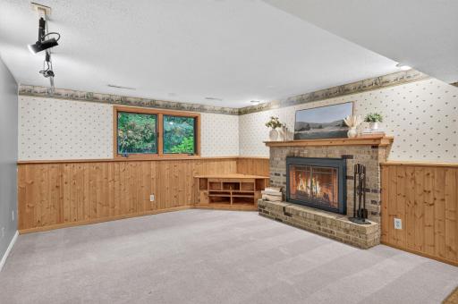 Lower Level Living Room -Brick Wood burning Fireplace.jpg