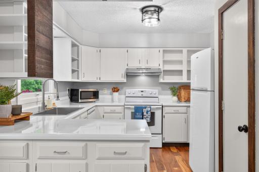 Kitchen - refinished counters, new sink and faucet.jpg