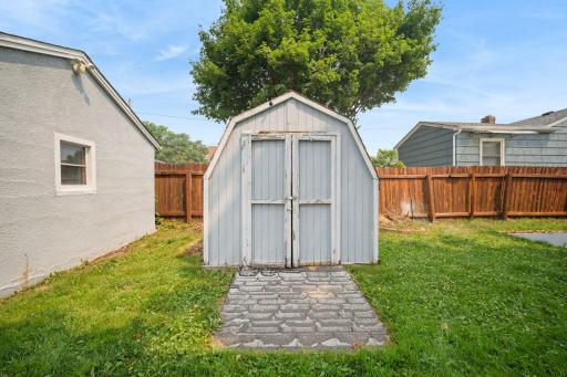 A classic storage shed ready for tools, bikes, or a weekend project space of your own.