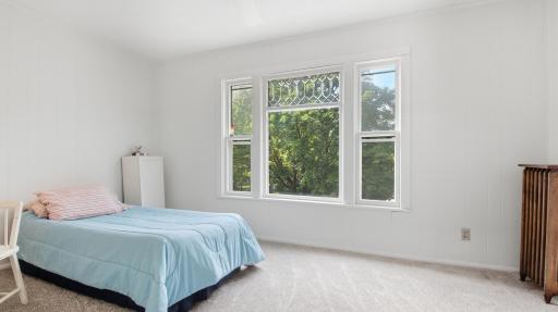 Bright, beautiful front bedroom with its beautiful window has a 10 x 4 walk-in closet (not shown).