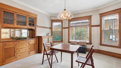 The spacious dining room with its beautiful, built-in hutch and gorgeous window.