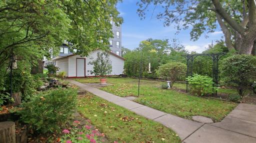 Ah - a personal, private haven--a peaceful backyard where perennials, ponds, and mature trees welcome songbirds galore.