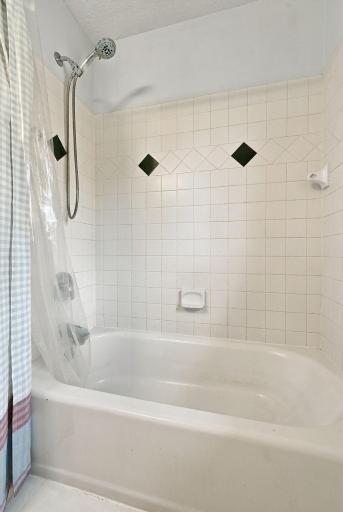 Bathtub in full sized bathroom on upper level