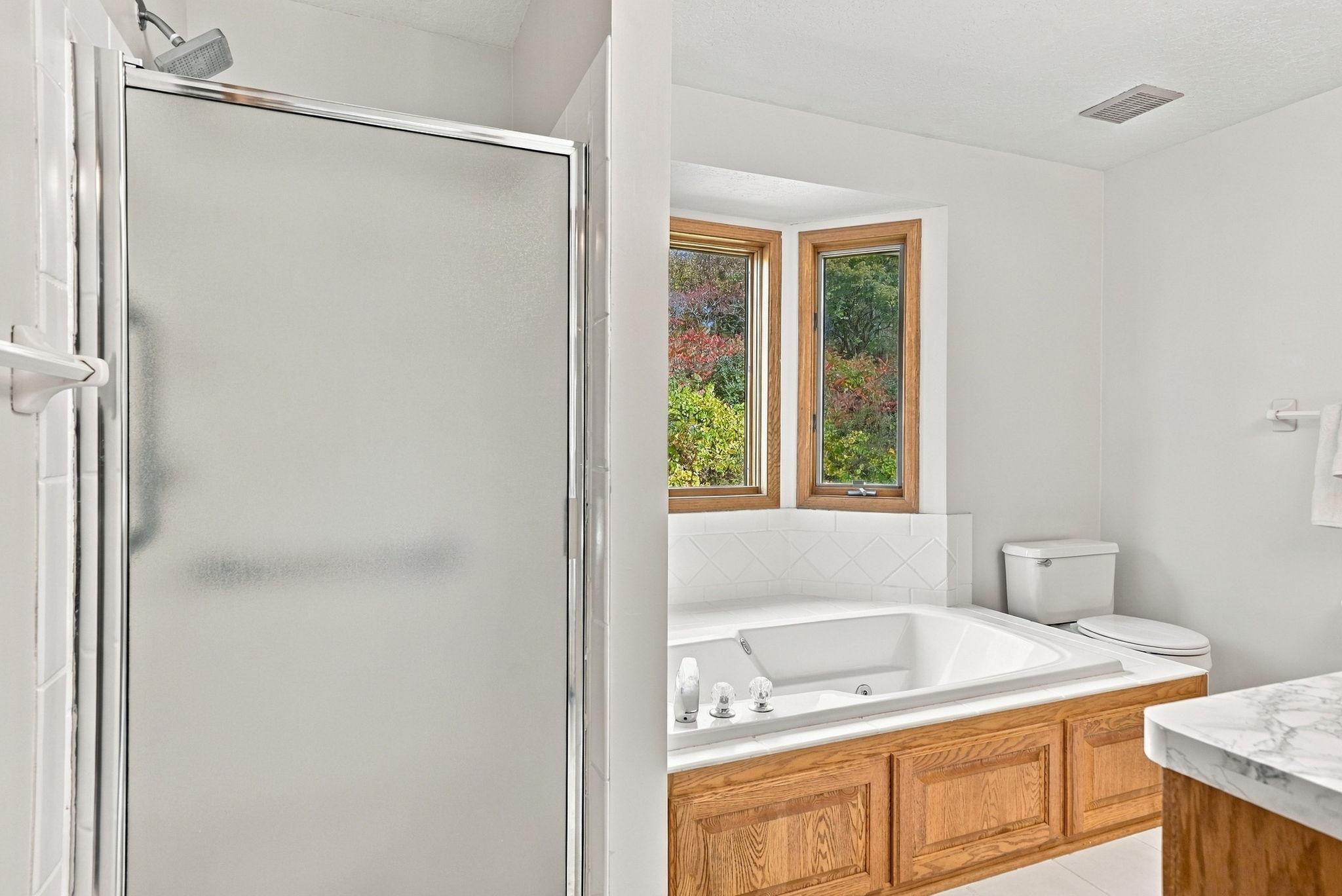 Separate shower and tub in primary bathroom