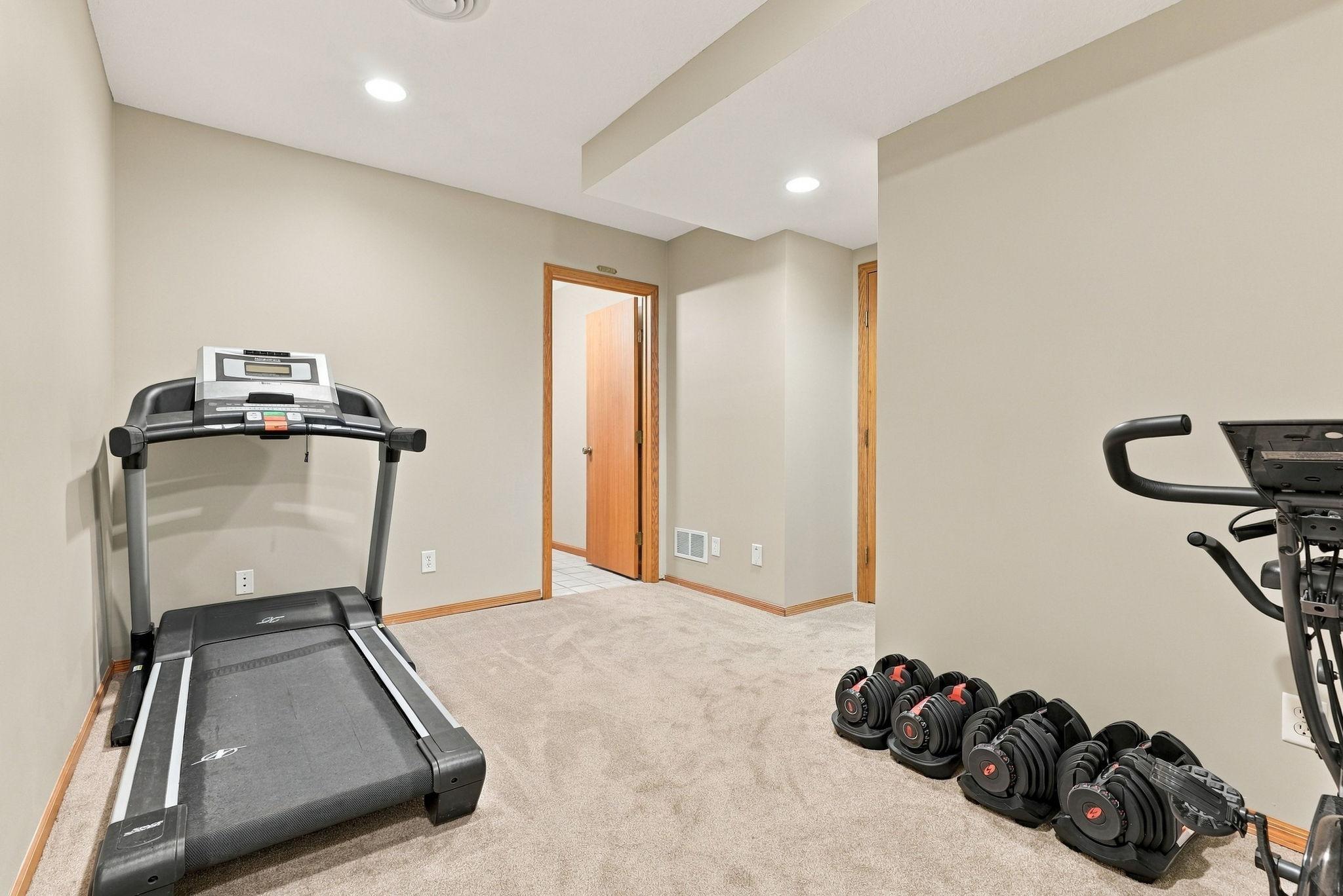 The lower level has enough hall space to create an exercise room