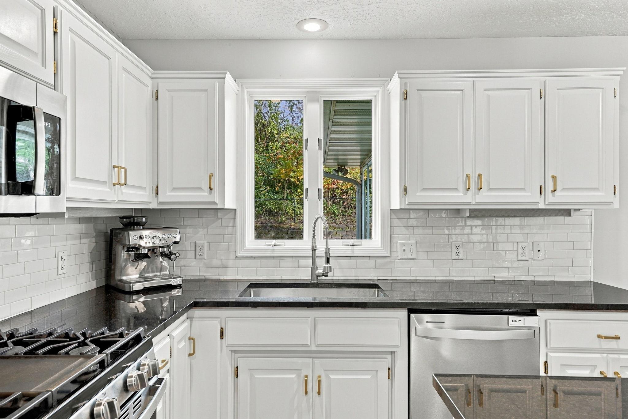 The kitchen window looks into the back yard.