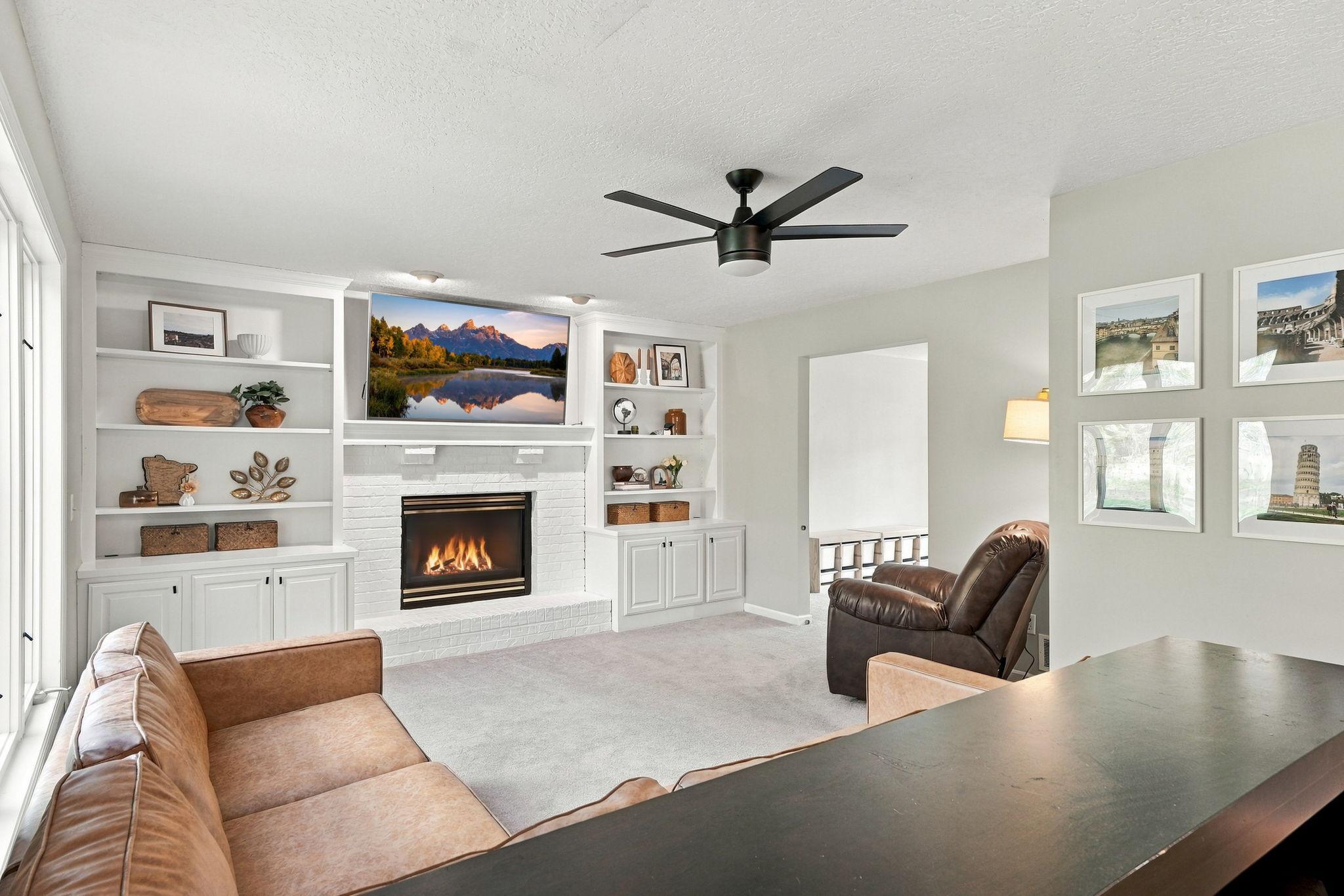 Built-in bookshelves and a gas fireplace make for a great spot to spend a relaxing evening.