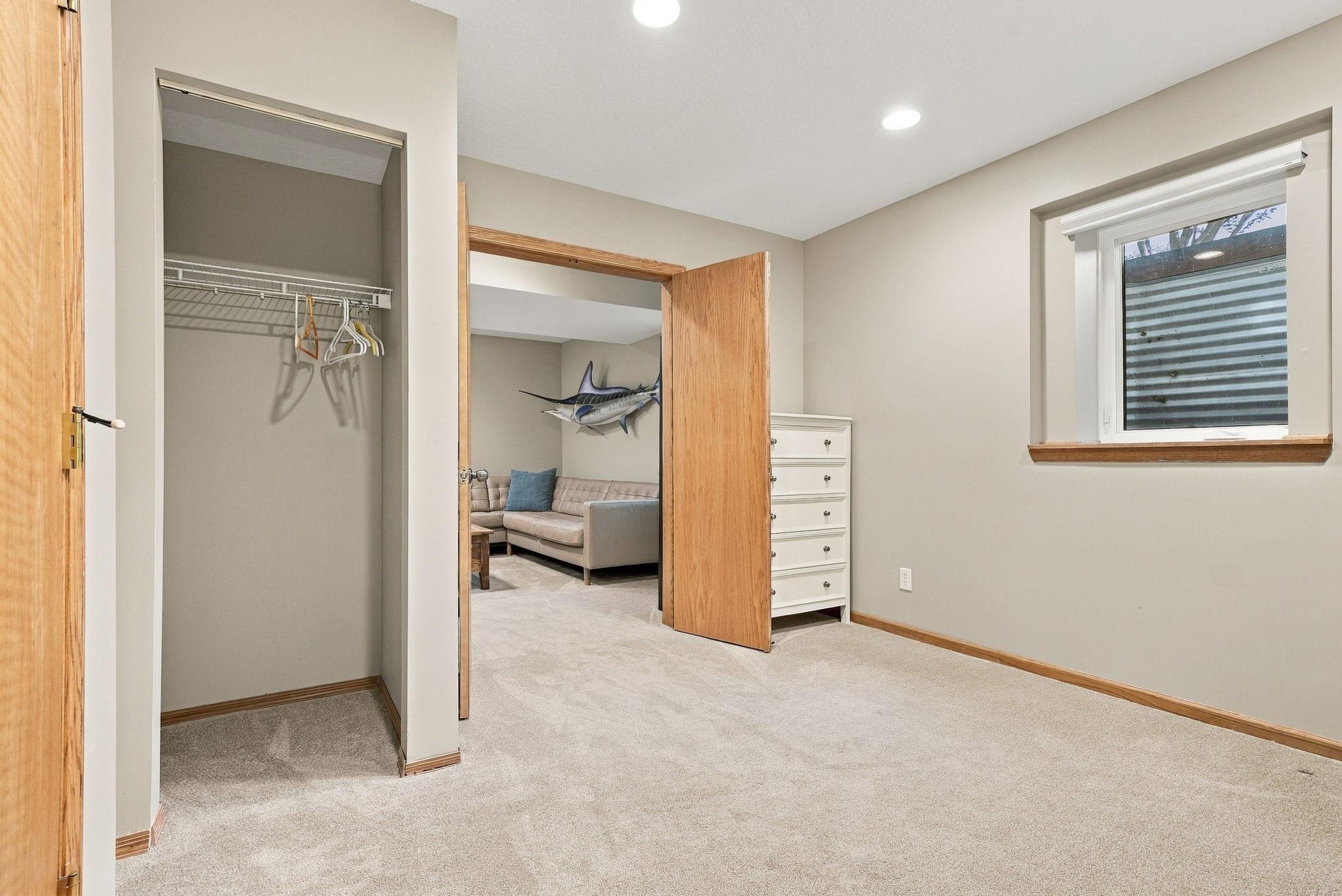 The fifth bedroom is located in the lower level