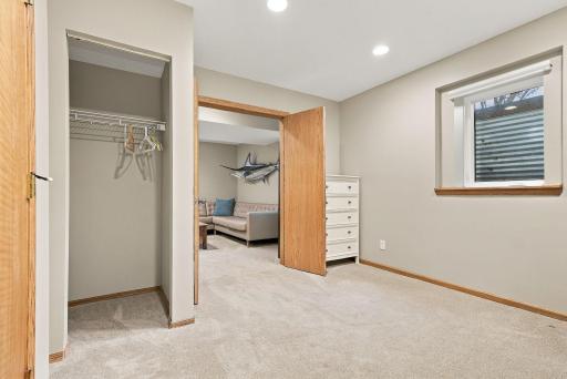 The fifth bedroom is located in the lower level