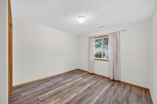 2nd Bedroom/Office features new flooring.
