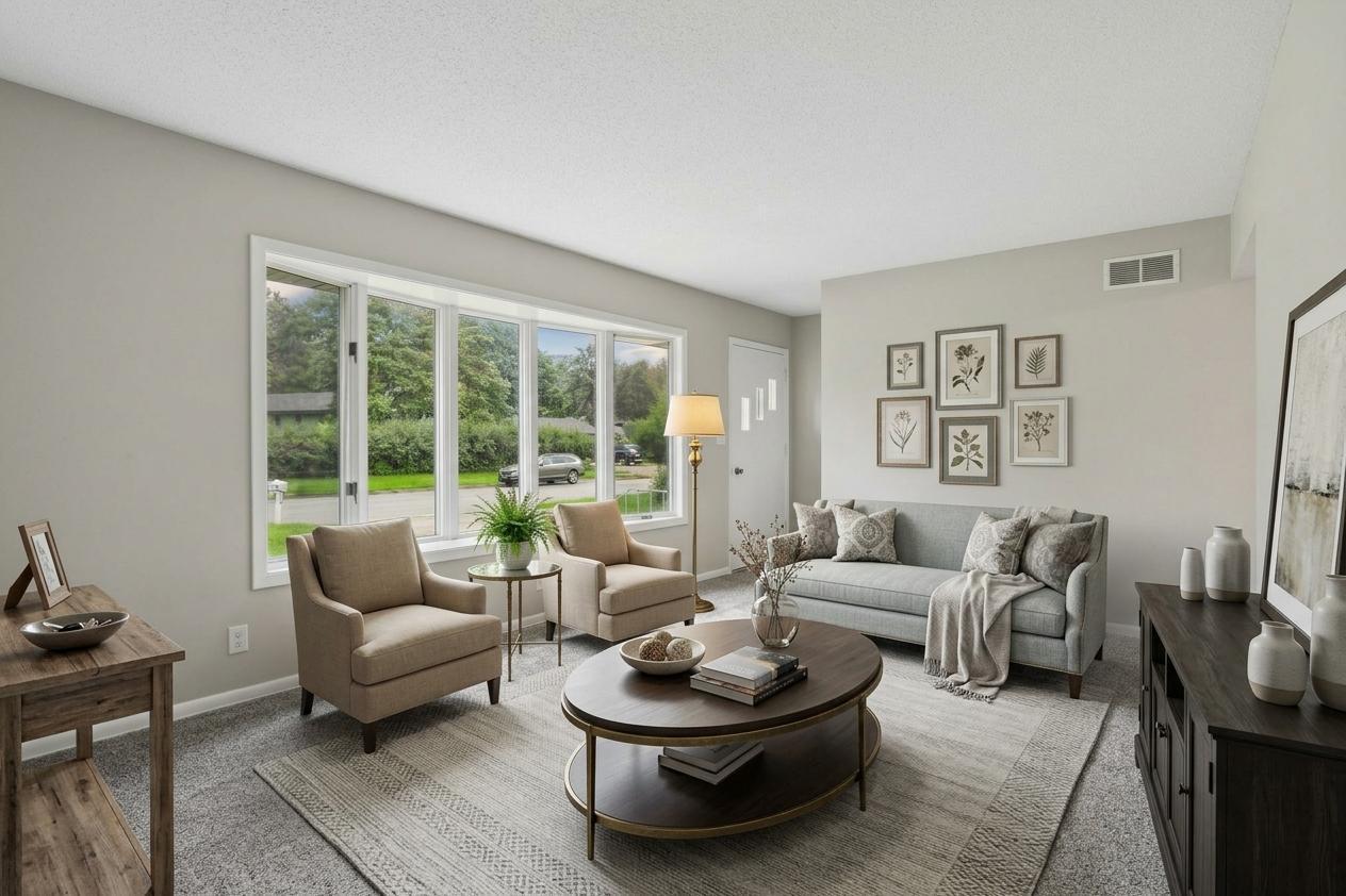 Inviting light filled living room. Virtually staged