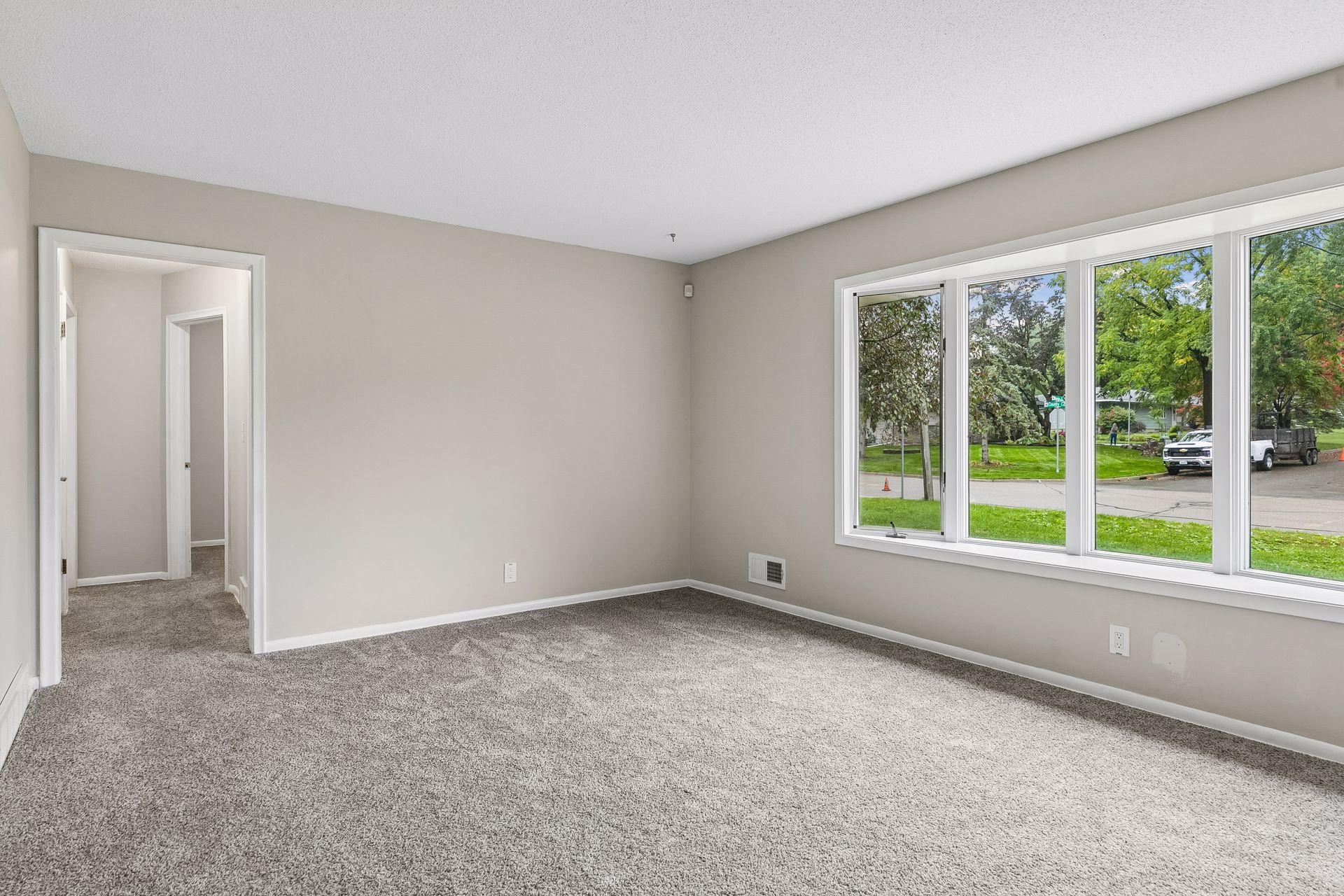 Spacious living room. Fresh paint and flooring throughout.