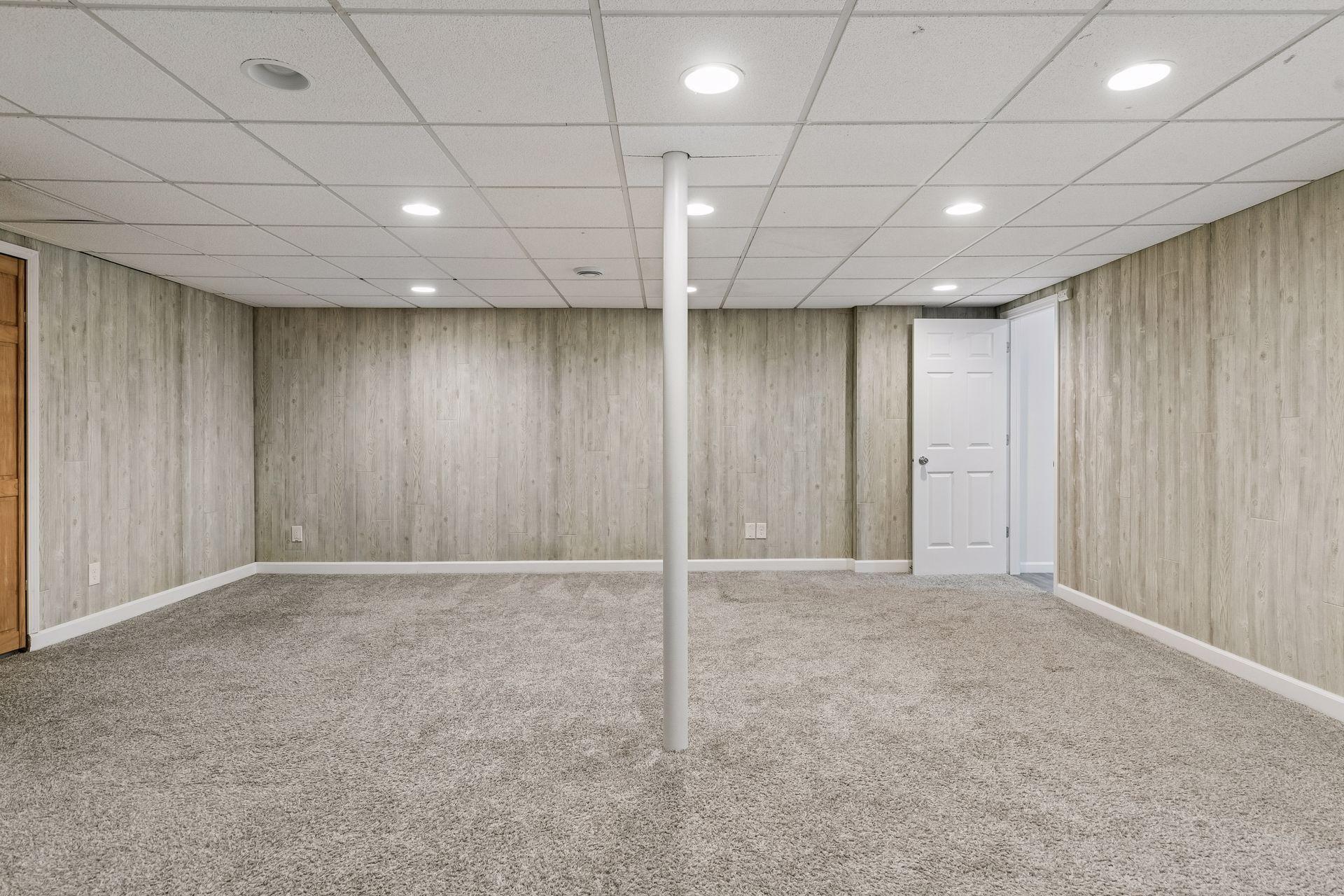 Family room with space for a pool table and media area.