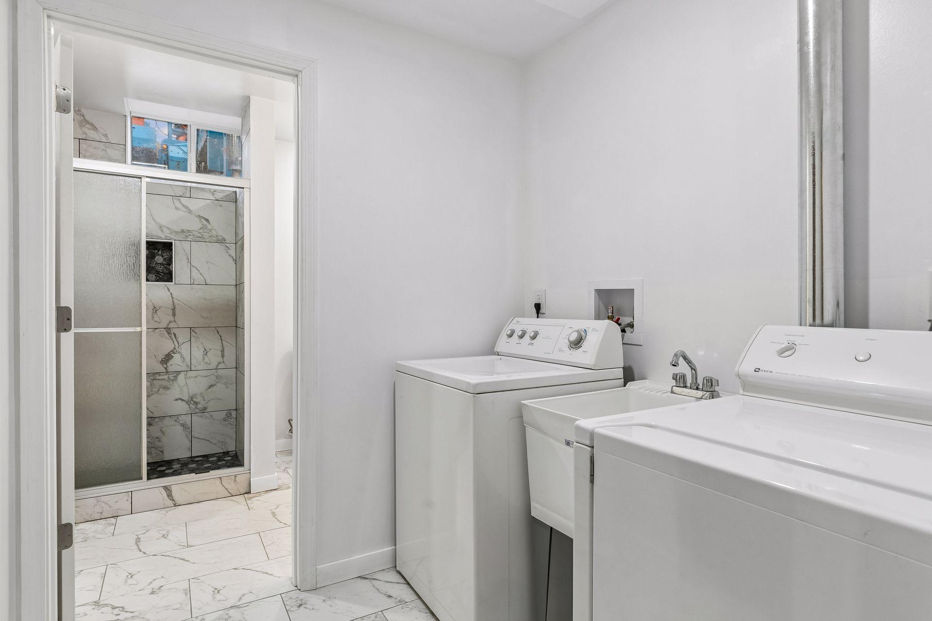 New laundry room and bath in lower level