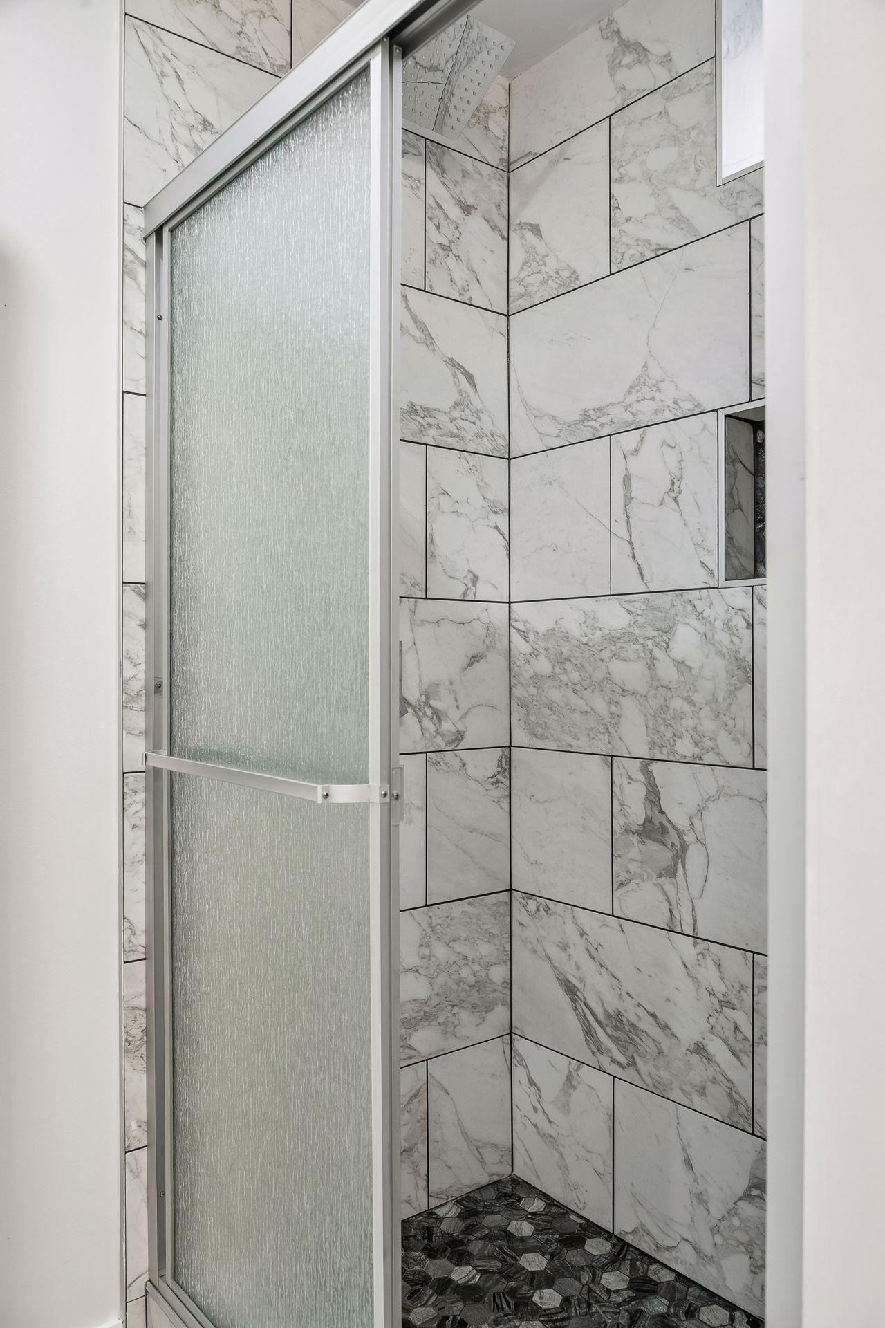 Beautiful tile 3/4 bath in lower level