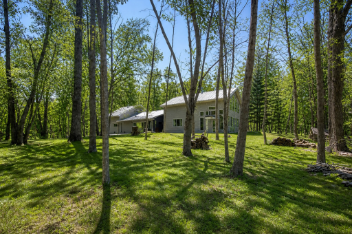 Back side of home (AI used to make yard/trees green)