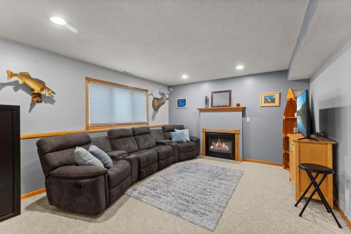 Lower level family room with gas fireplace