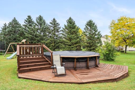 Above ground swimming pool with sand filter and new deck