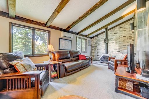 Coz upper-level family room w/wood fireplace