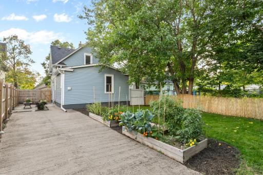 Private back yard featuring newer ( 2023 ) 6 ft fence ( along the east & north side ) , Patio & raised gardens