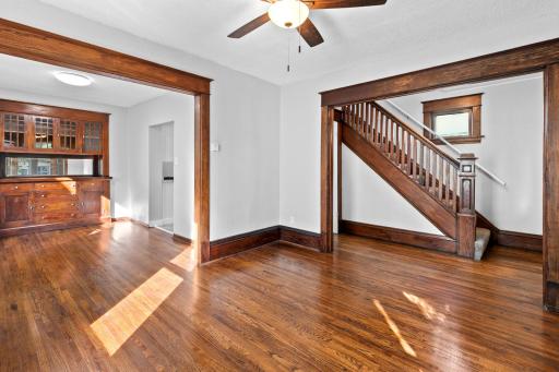 A look from the living room with the dining room on the left & open staircase to second level !