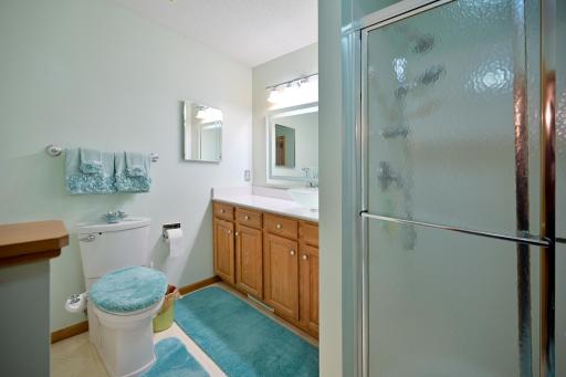 Primary bathroom with spacious vanity and separate shower.