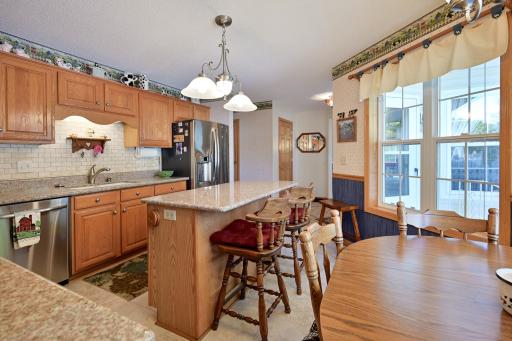 Breakfast bar/center island, and newer stainless steel appliances.