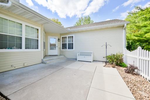 Large front patio surrounded by beautiful green spaces.