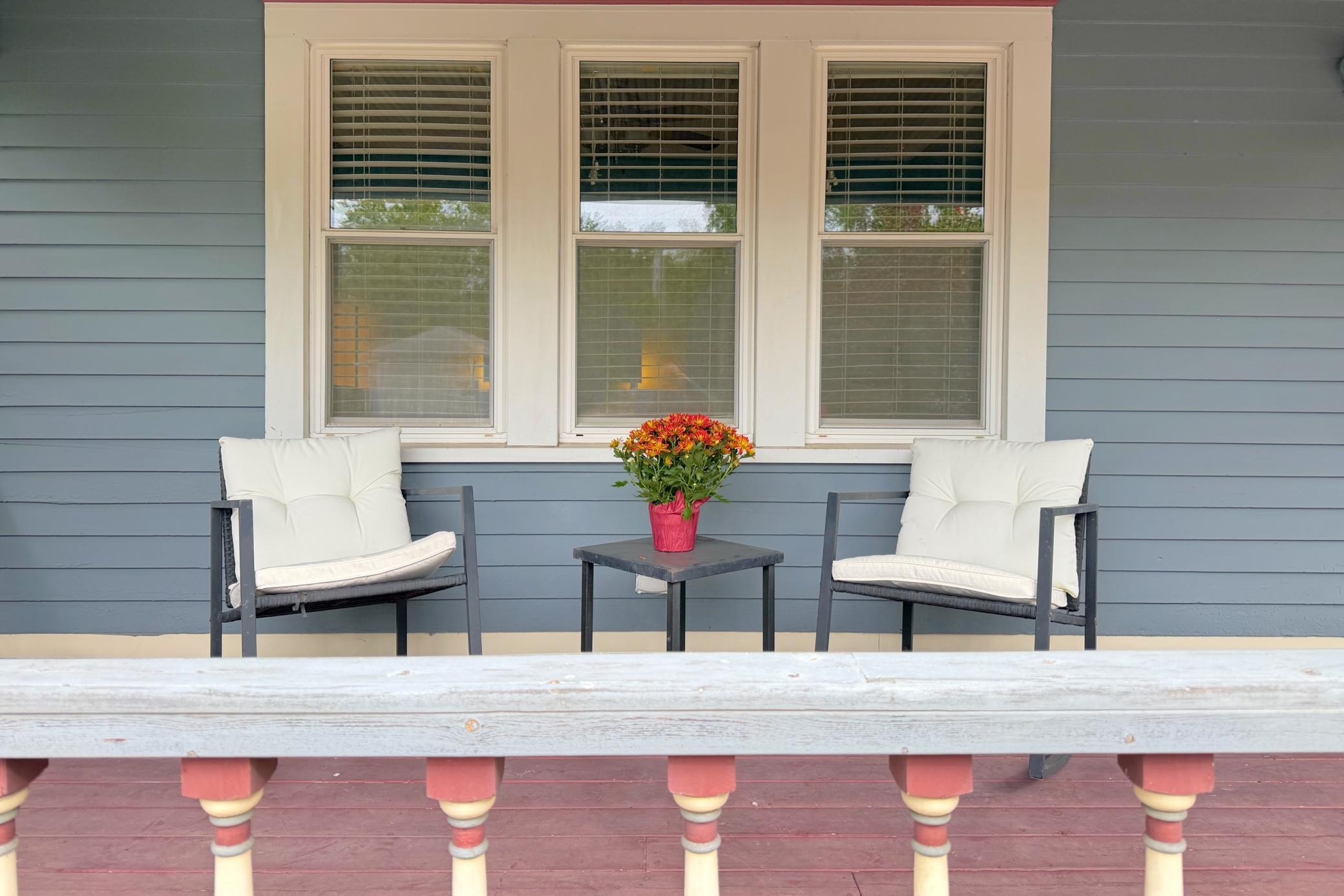 Freshly painted front porch offers classic Saint Paul charm.
