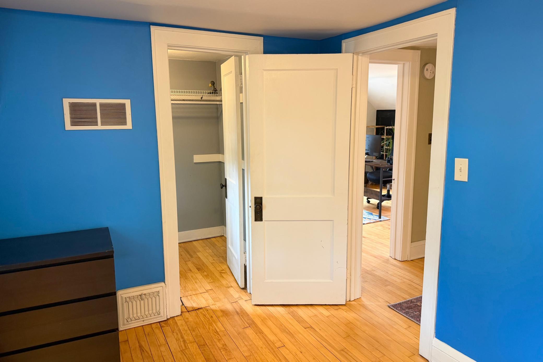 Rare walk-in closet provides exceptional storage and organization.