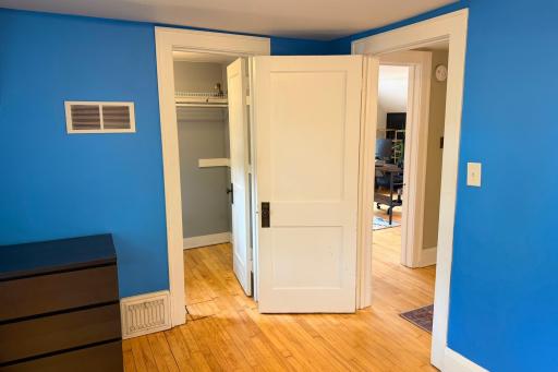 Rare walk-in closet provides exceptional storage and organization.
