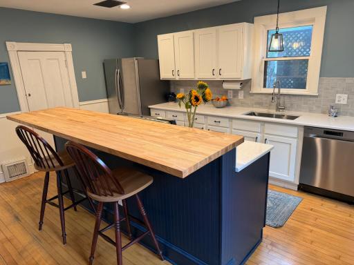 Thoughtfully updated with added cabinetry, modern finishes, and exceptional storage.