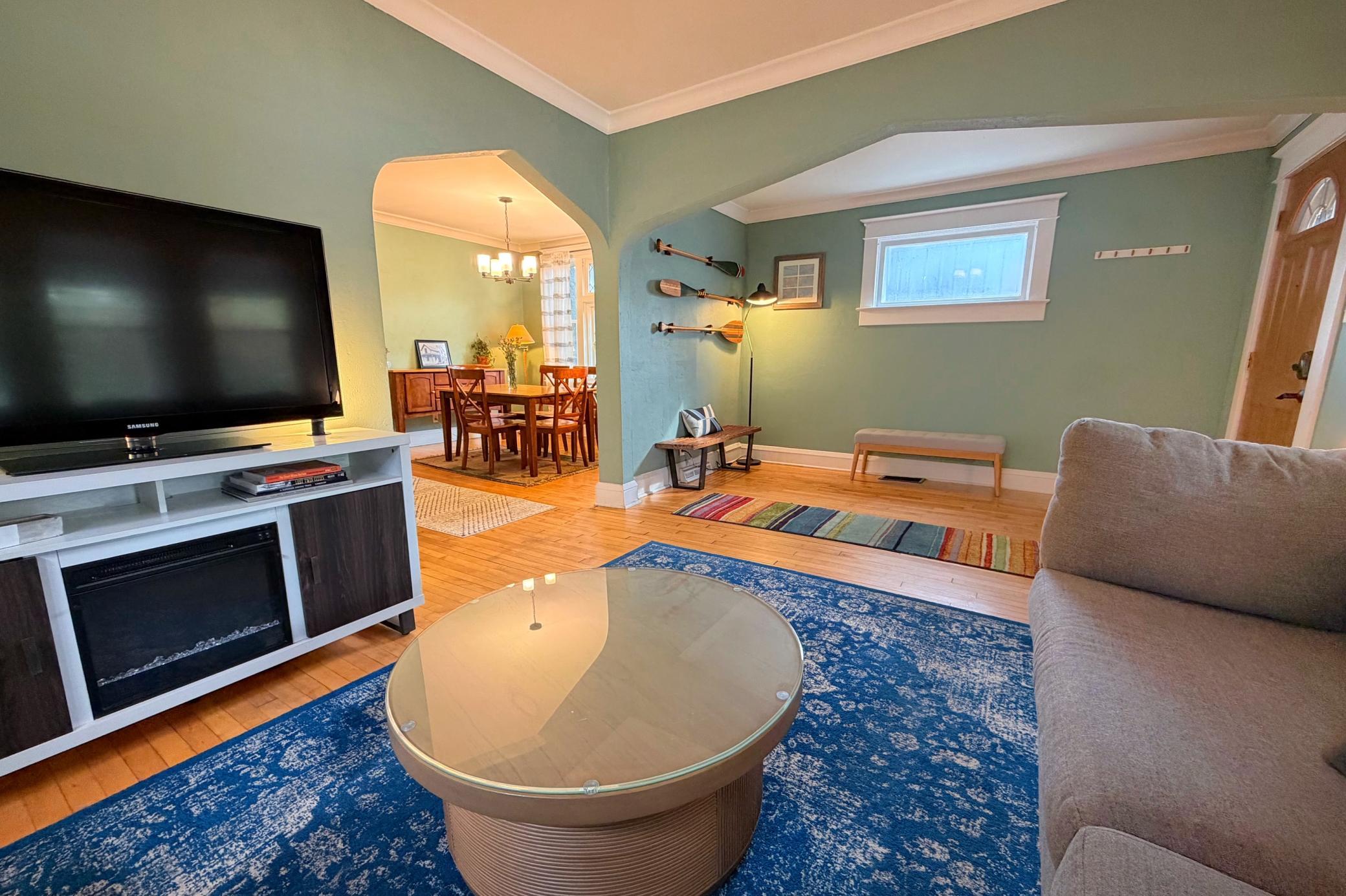 Bright, inviting living room blending historic character with modern comfort.