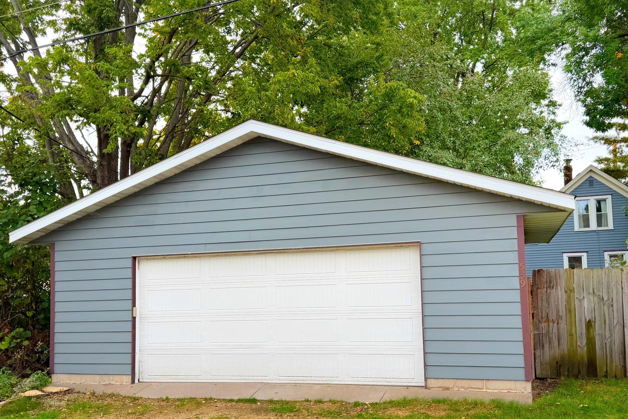 Oversized 26' x 24' garage with room for vehicles, storage, and hobbies.