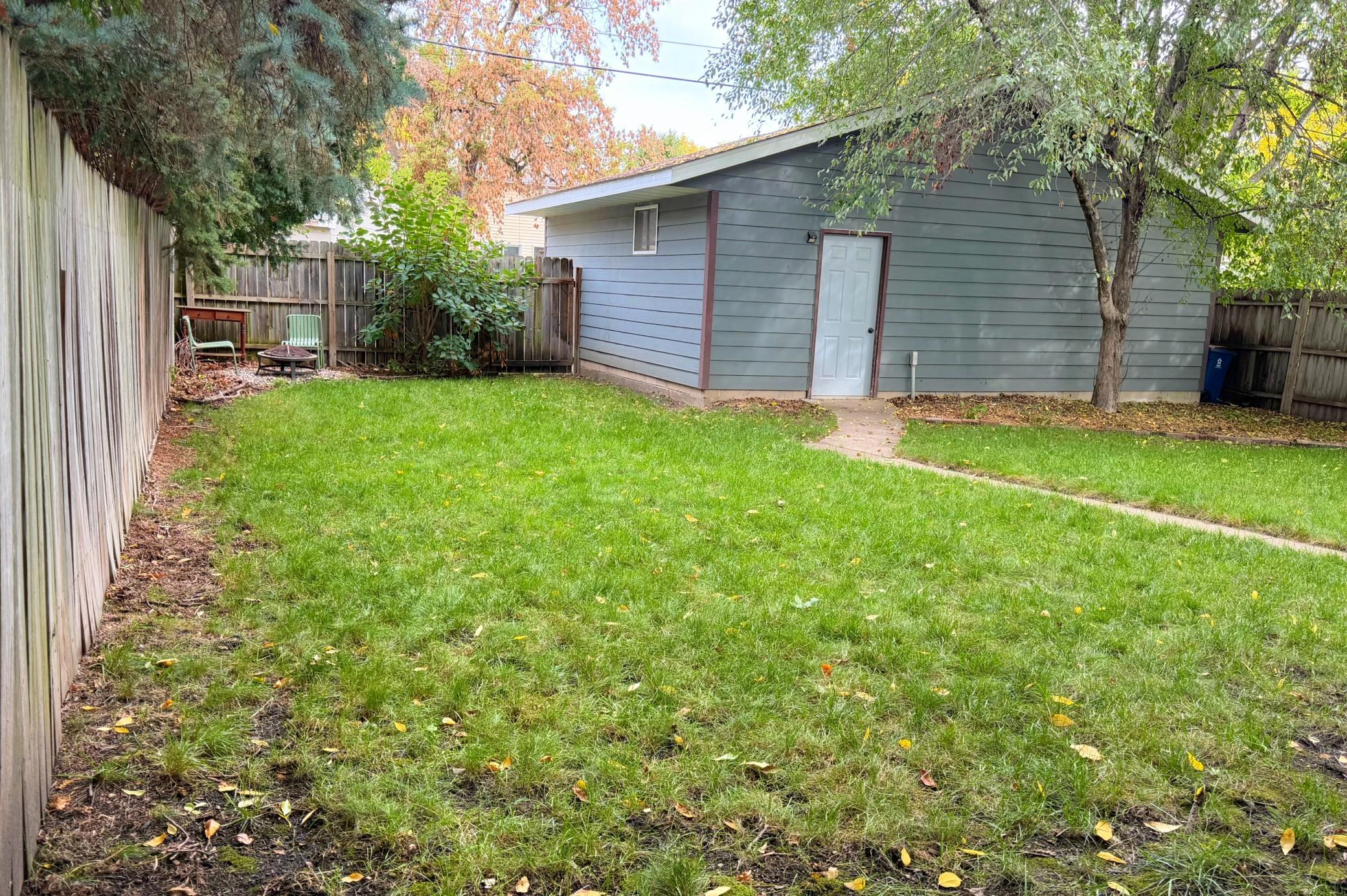 Large backyard with rare oversized two-car garage.