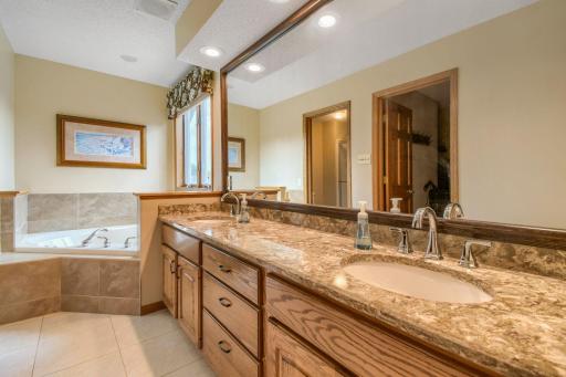 Primary ensuite with double sink with quartz countertops by Cambria.