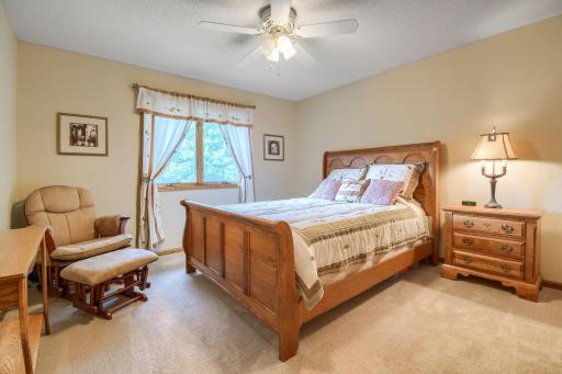 Spacious bedroom featuring a large window, neutral finishes, and plenty of room for additional furnishings.