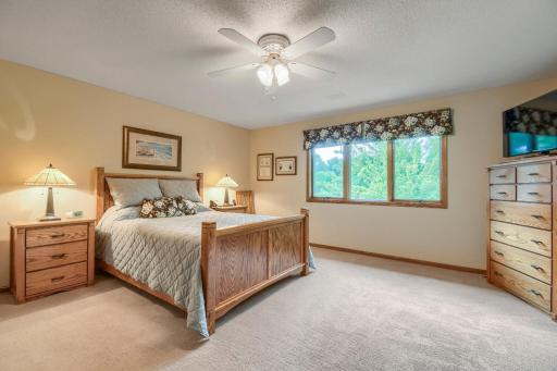 Comfortable bedroom with a large window providing plenty of natural light.