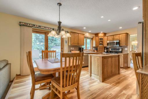 Open kitchen and informal dining area with center island and convenient access to the backyard deck.